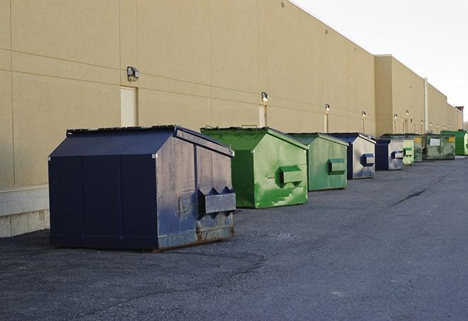 red and green waste bins at a building project in Cumming